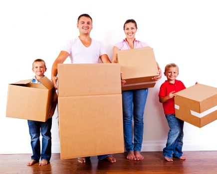 People organizing belongings with a focus on storage and space management