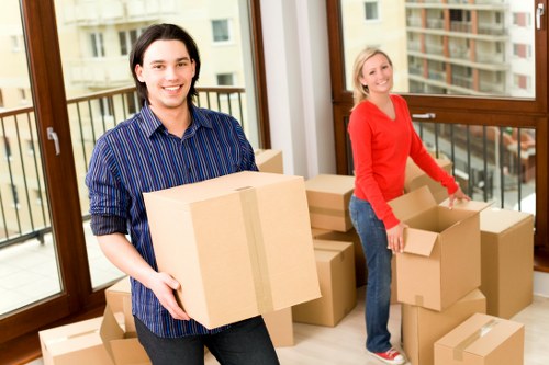 Professional movers handling furniture during a move in Gideapark